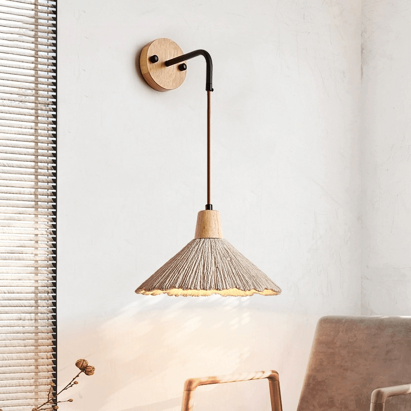 Adjustable wall sconce providing soft lighting in a restaurant interior