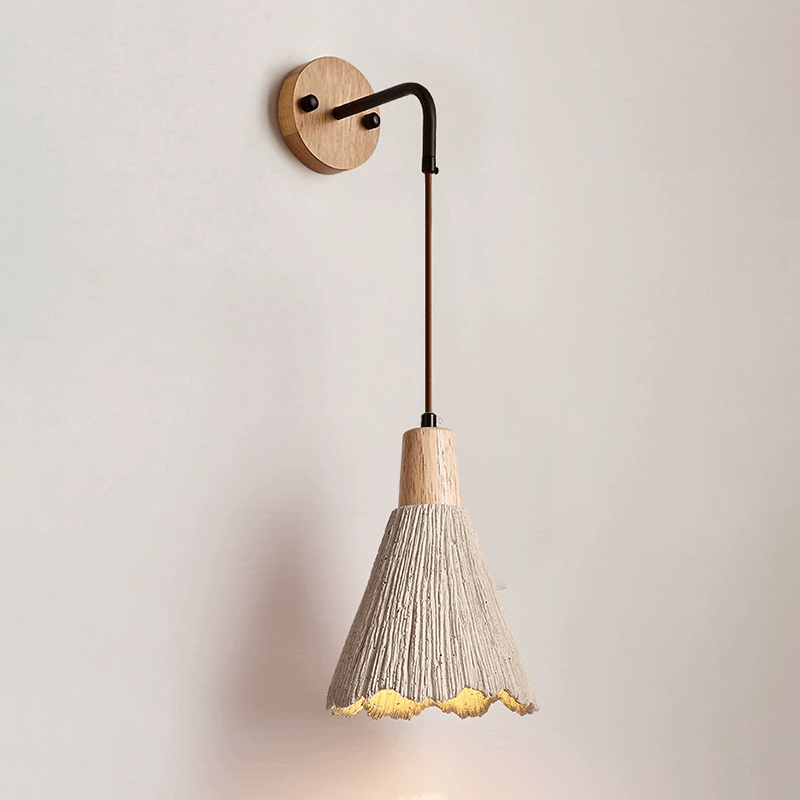 Close-up of the natural wood finish on the wall sconce