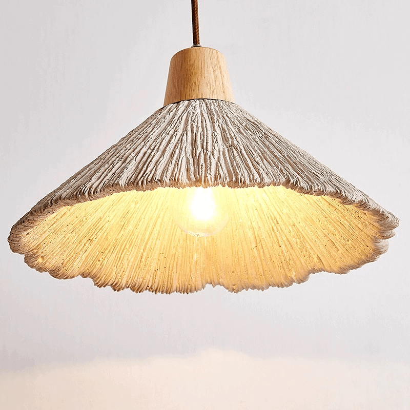 Close-up of the natural wood finish on the wall sconce