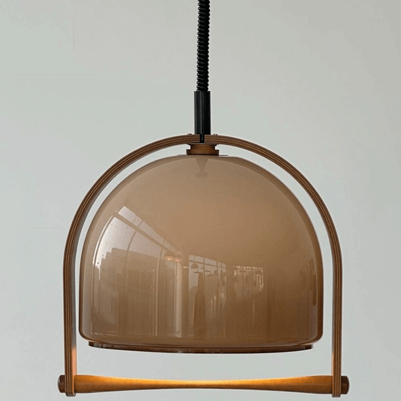 Timeless Mid-Century Dome Pendant Lamp elegantly illuminating a dining area with its vintage charm.
