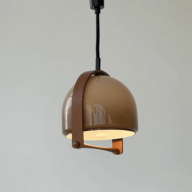 Timeless Mid-Century Dome Pendant Lamp elegantly illuminating a dining area with its vintage charm.