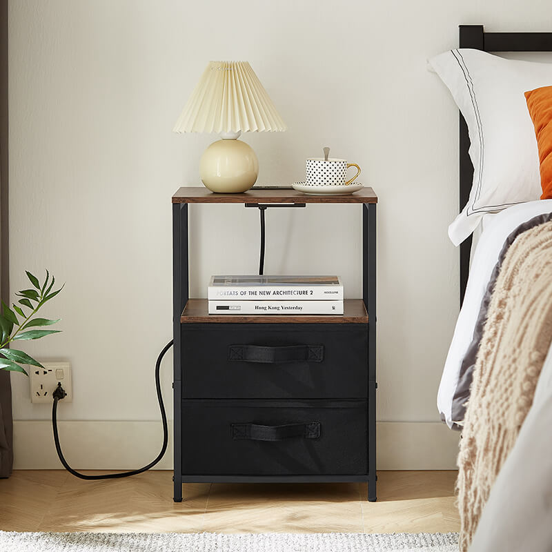 Side view of the modern bedside table with USB port and two drawers in a cozy bedroom.