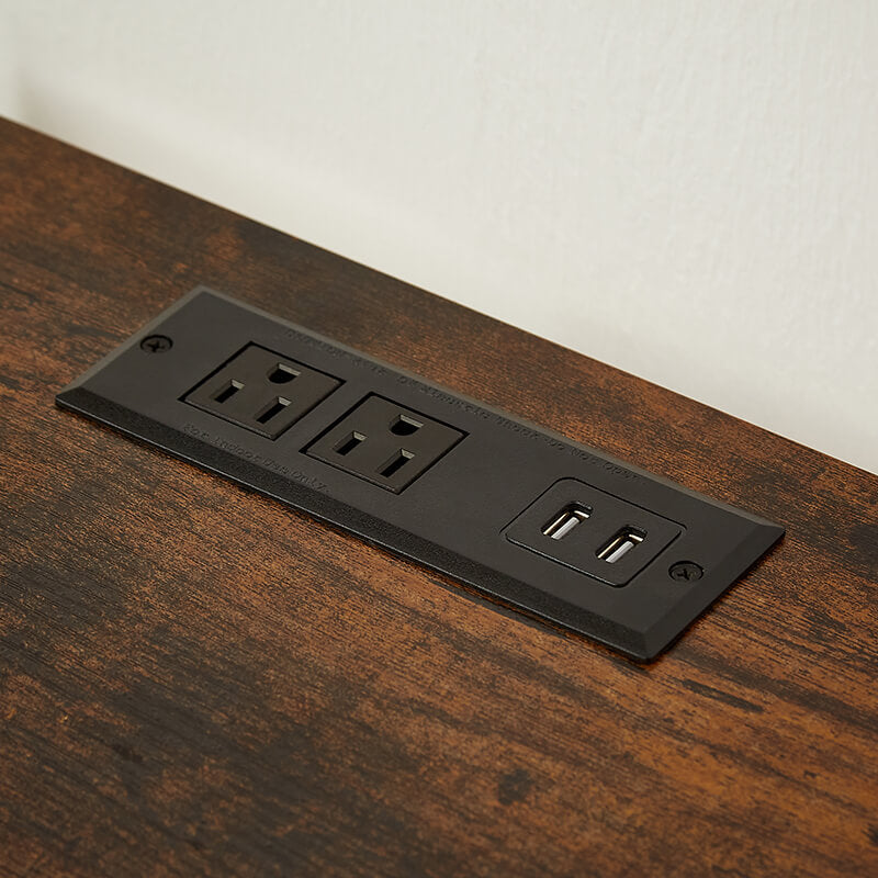 Side view of the modern bedside table with USB port and two drawers in a cozy bedroom.