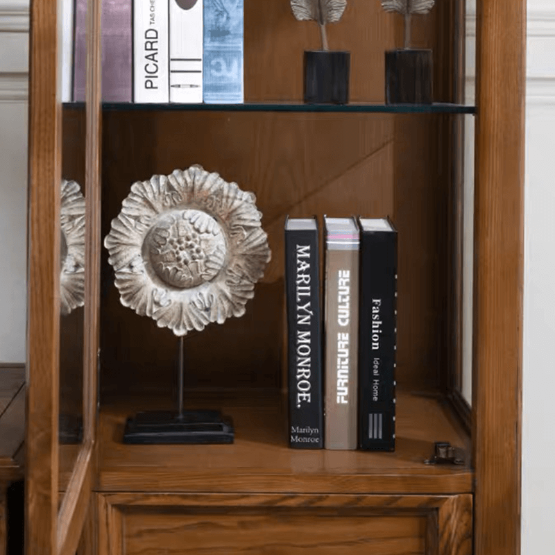 Side view of the stylish walnut cabinet showcasing its sleek design and glass doors.