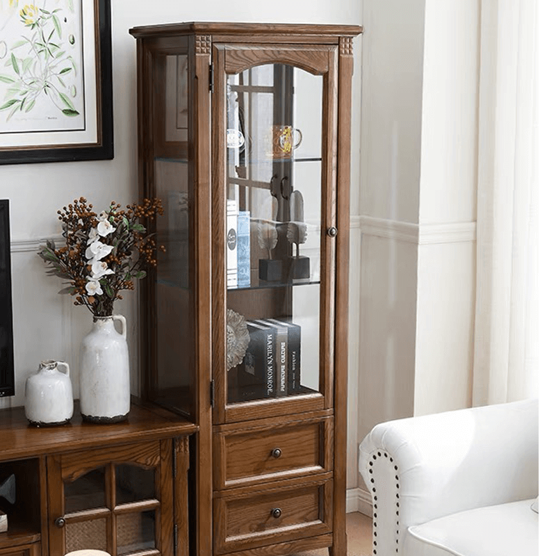 Side view of the stylish walnut cabinet showcasing its sleek design and glass doors.
