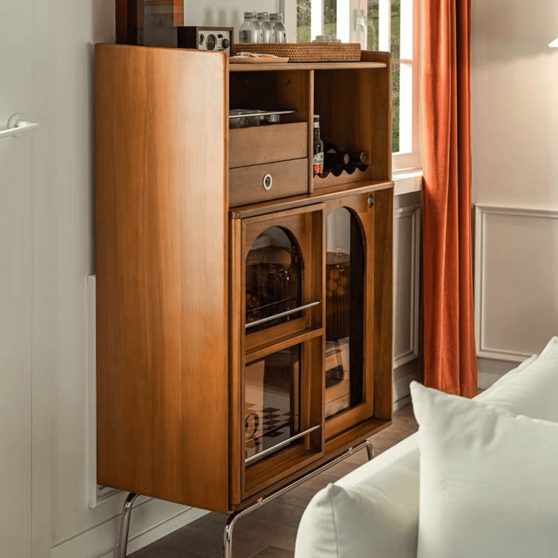 Close-up of the drawers and glass doors of the mid century modern wine cabinet highlighting its craftsmanship.