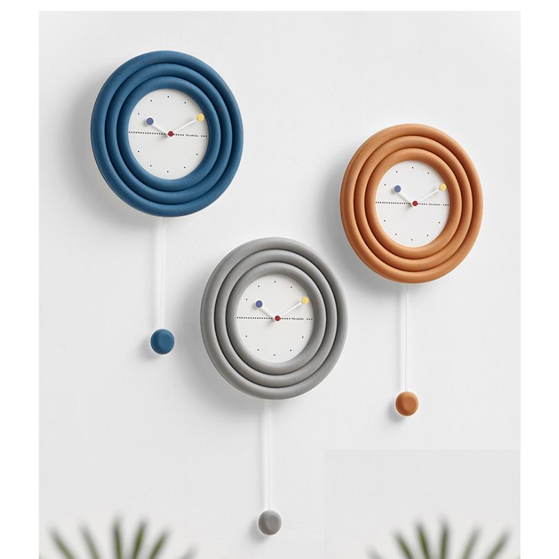 The wall clock shown in an office setting, emphasizing its functionality and stylish presence.