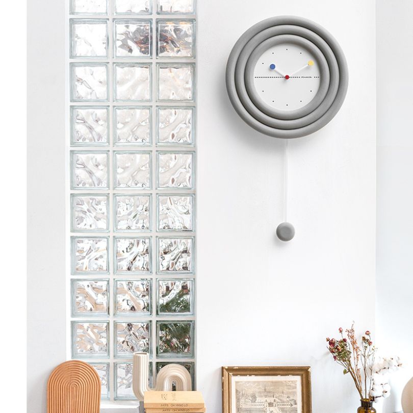 Elegant 3D geometric wall clock displayed in a modern living room, highlighting its stylish design.