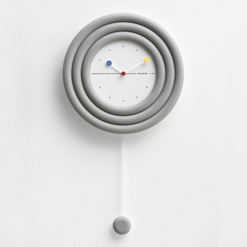 The wall clock shown in an office setting, emphasizing its functionality and stylish presence.