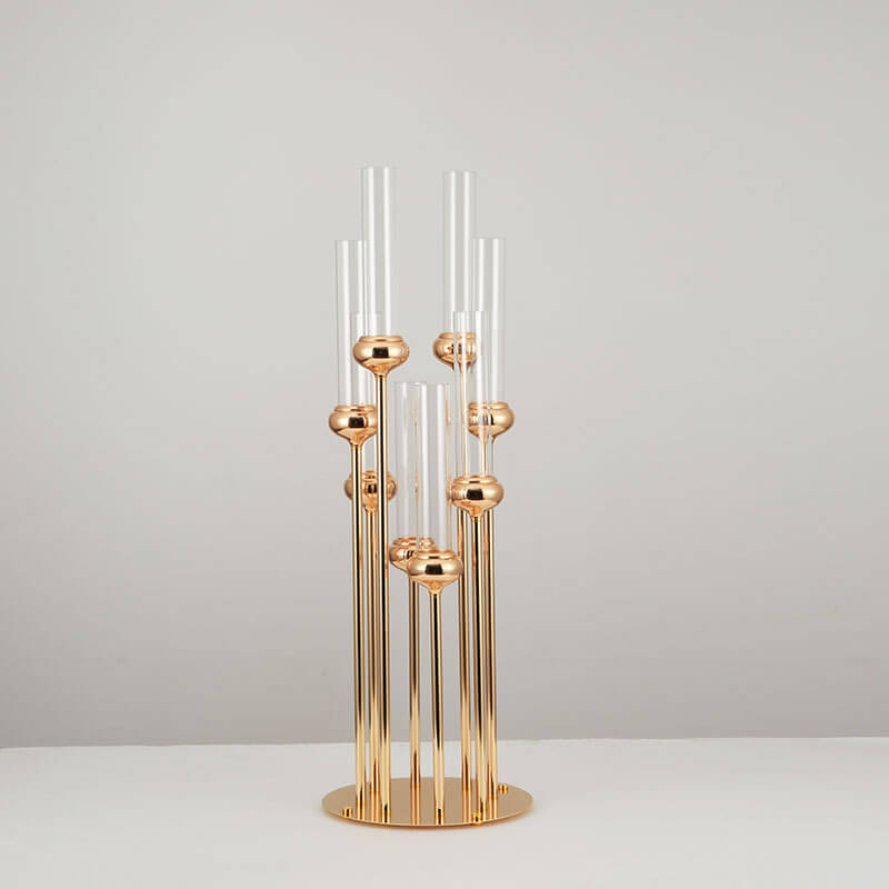 Chic minimalist luxury candle holders showcasing a gold finish on a modern table setting.