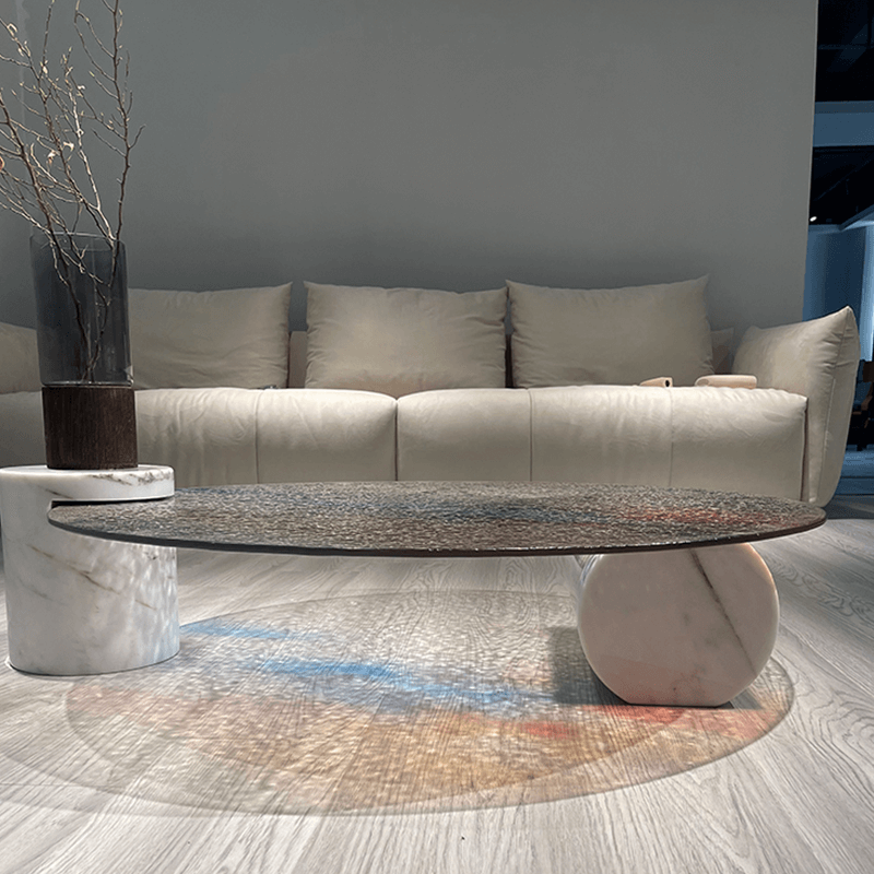 Vibrant Ripple Glass Coffee Table showcasing its unique water rippling effect in a modern living room setting.