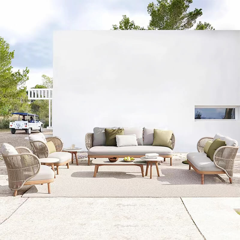 Elegant rattan patio set arranged on a sunny deck