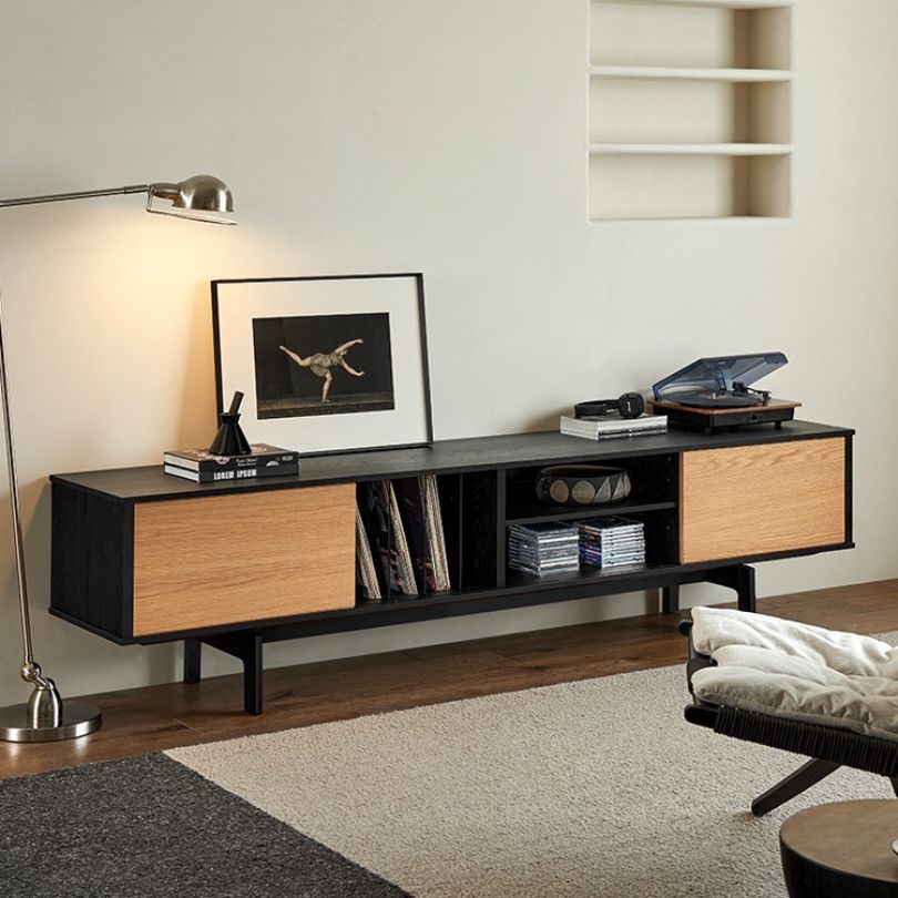 Front view of sleek black TV stand in solid wood, perfect for modern decor.