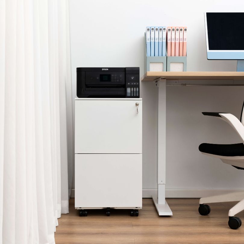 Close-up of the white filing cabinets smooth finish and modern design elements.