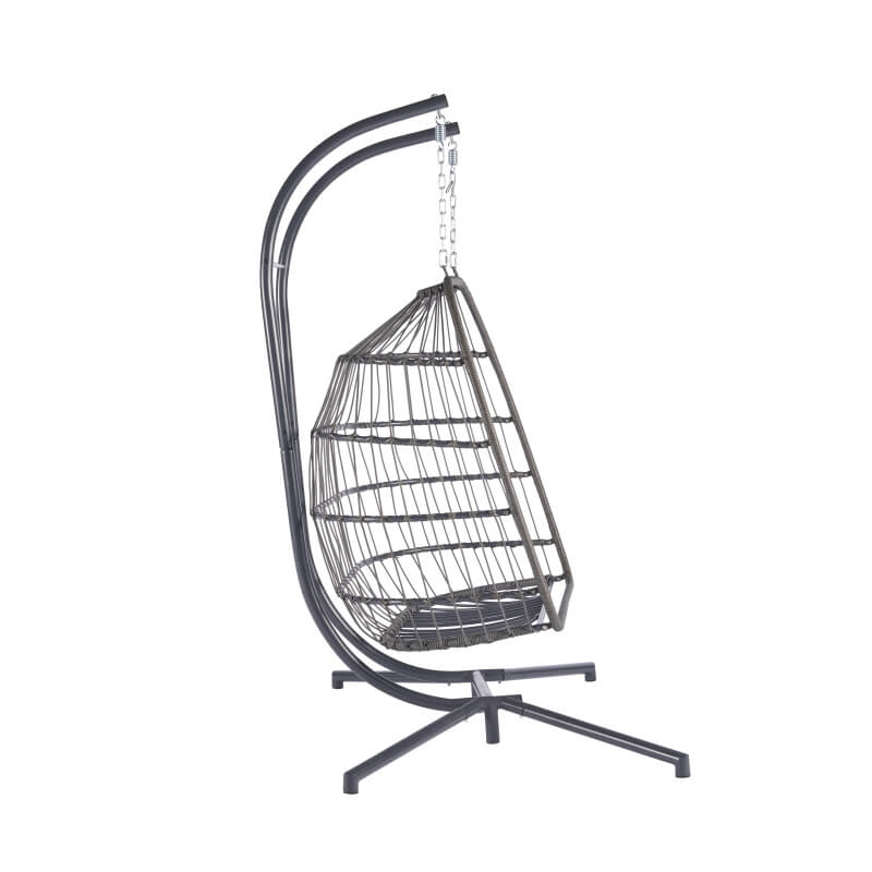 Side view of the stylish rattan egg chair for two on a patio.