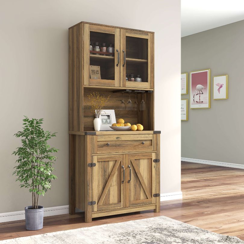 Close-up of the goblet holder feature on the farmhouse cabinet, demonstrating its stylish design.