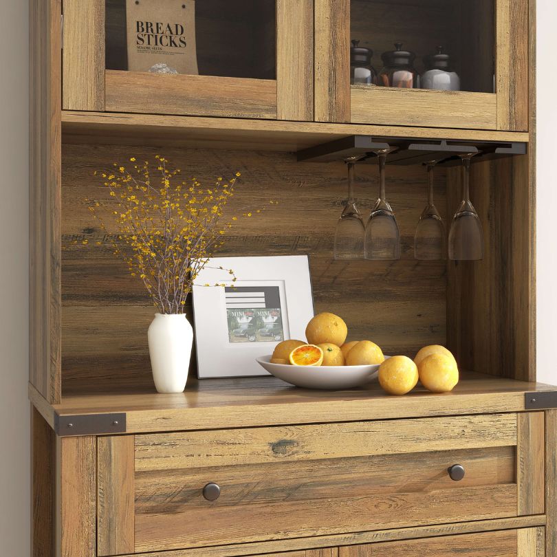 Close-up of the goblet holder feature on the farmhouse cabinet, demonstrating its stylish design.