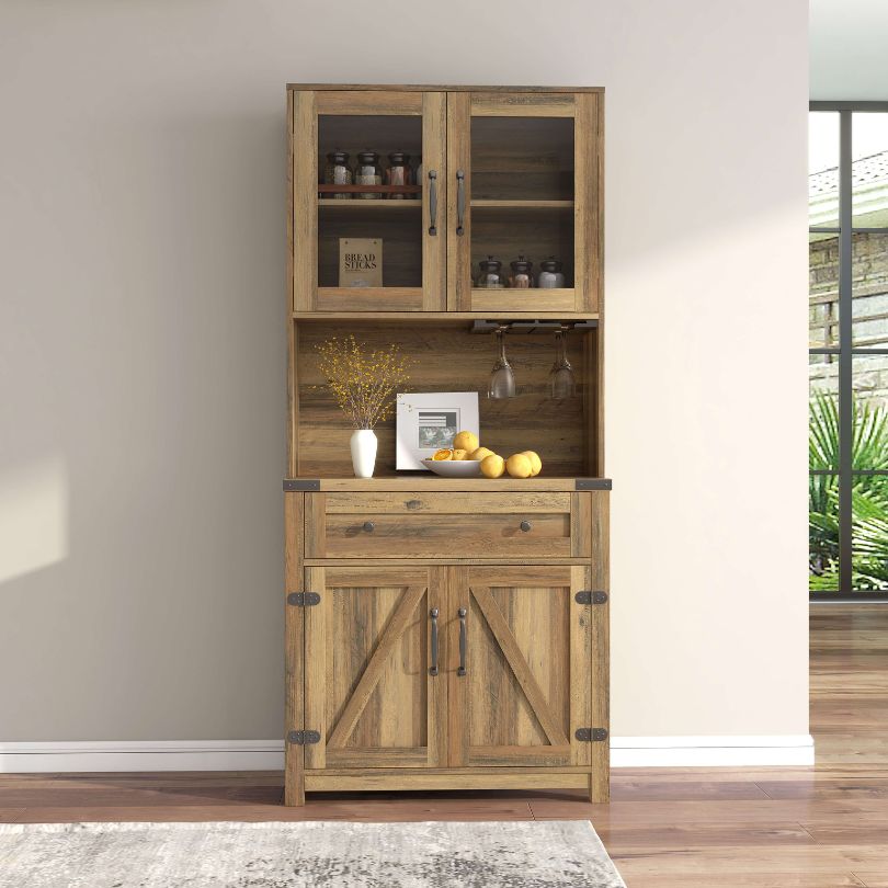 Front view of the rustic yellow walnut farmhouse cabinet with barn doors and goblet holder.