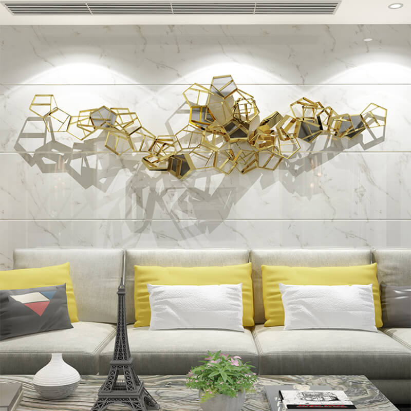 Elegant 3D geometric metal wall art displayed in a contemporary living room.