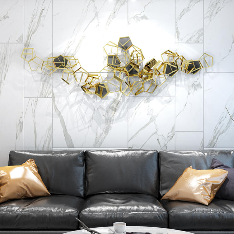 Close-up of the reflective surface of the modern geometric wall decor.