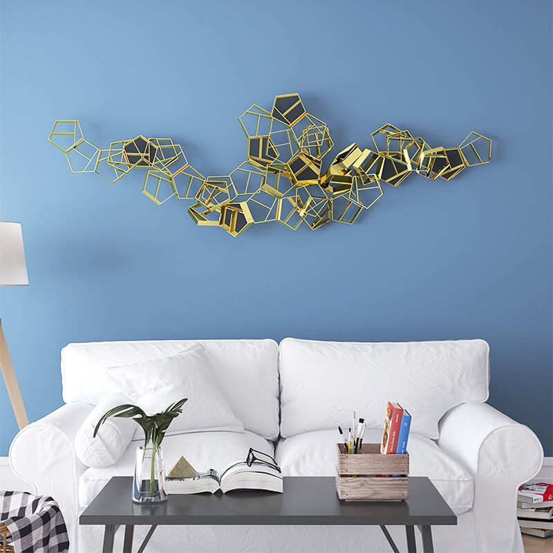 Elegant geometric wall art accentuating a cozy bedroom ambiance.