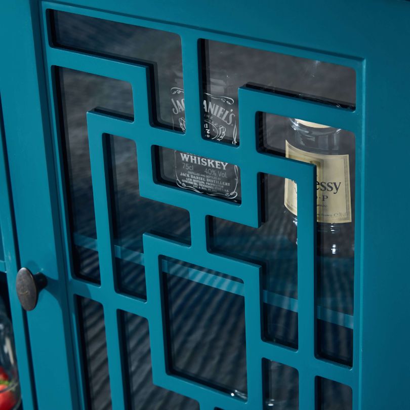 Front-facing view of teal blue sideboard with glass doors, ideal for blue furniture styling.