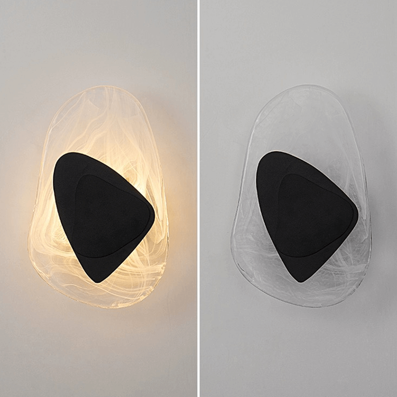 Close-up view of the stylish glass lamp, highlighting the tri-tone finish in bronze, black, and clear.