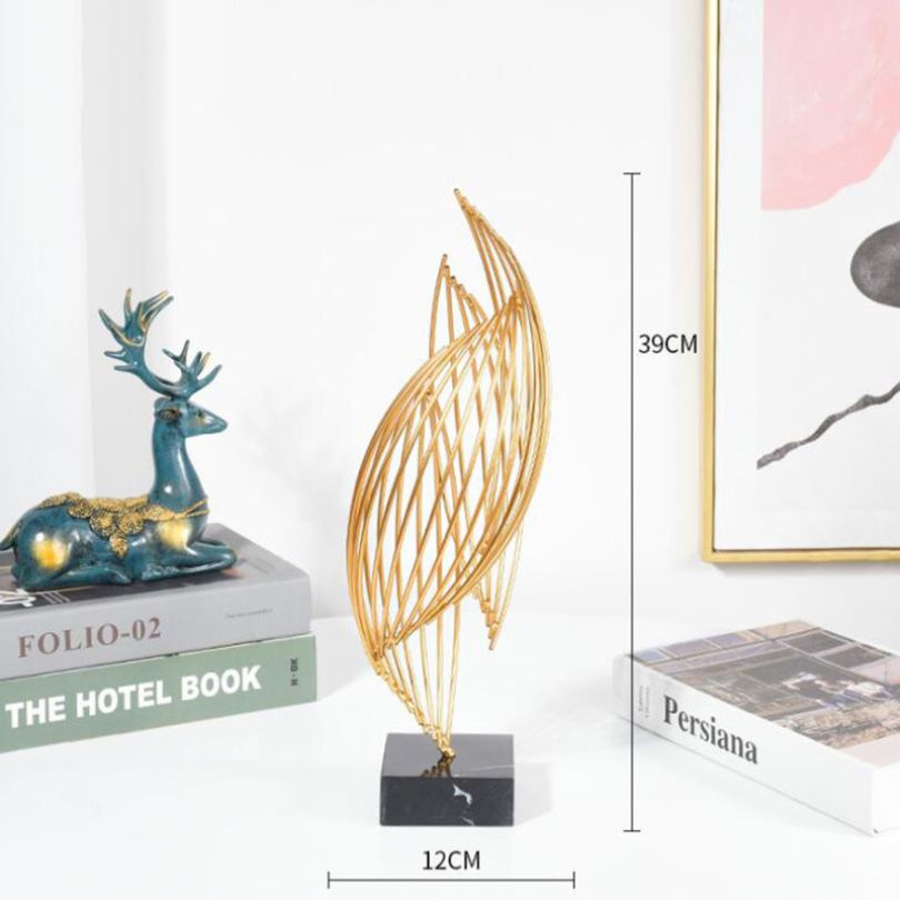 Wavy metal ornament on an office desk, enhancing the workspace ambiance.
