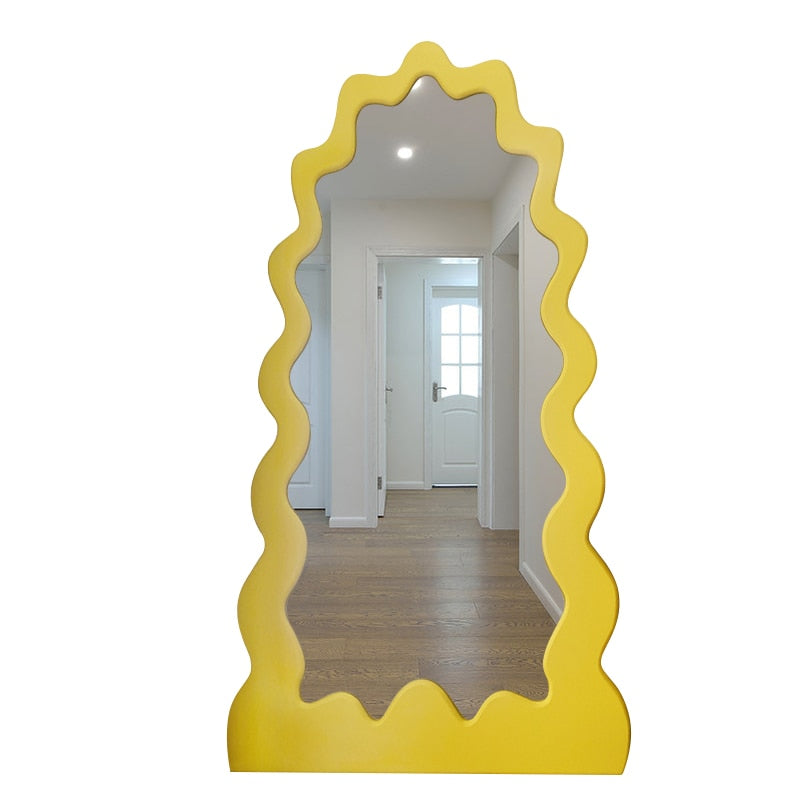 Angled view of the modern mirror in a cozy bedroom setup