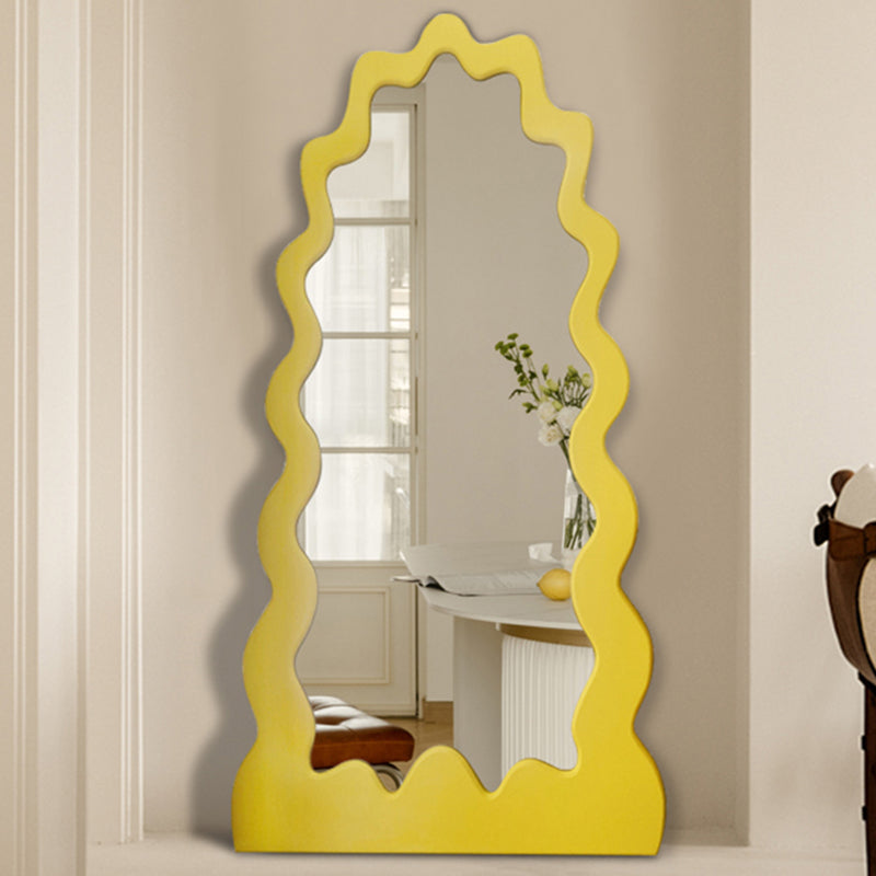 Close-up of yellow frame texture and mirror curvature showing artisan craftsmanship