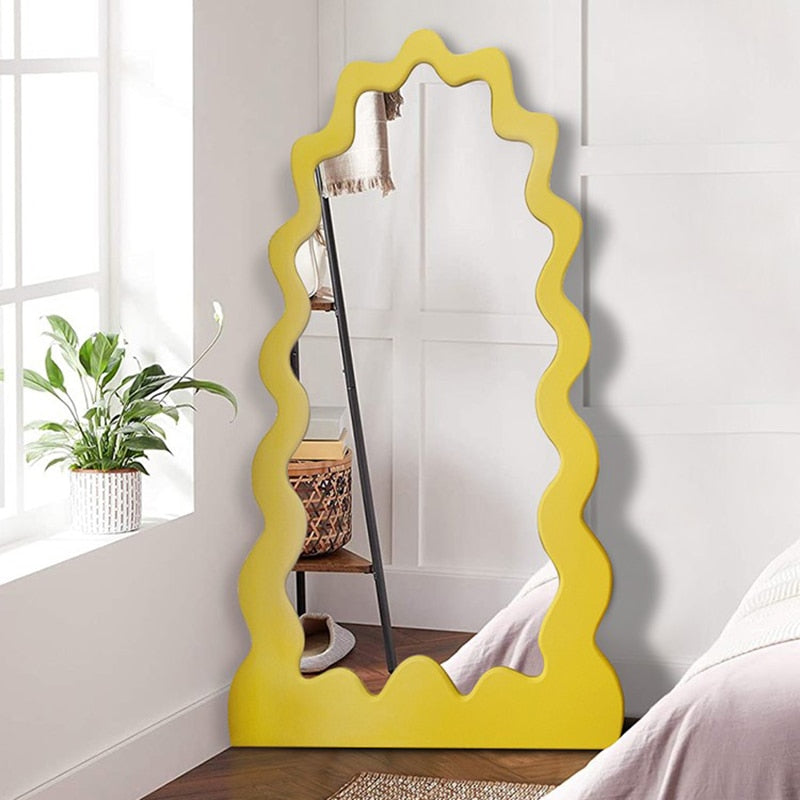 Angled view of the modern mirror in a cozy bedroom setup
