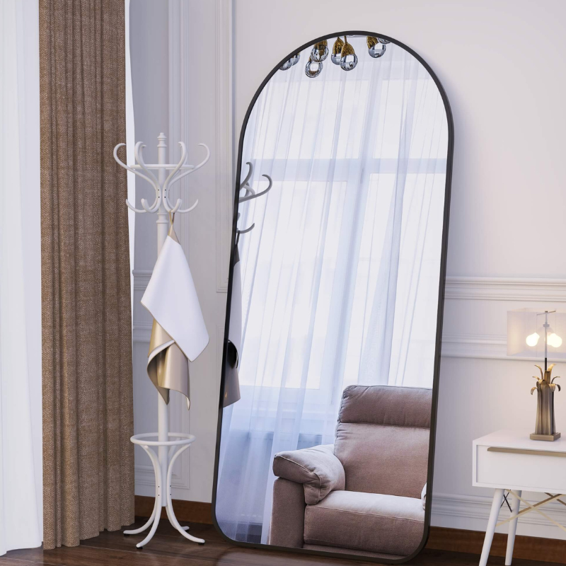 Close-up of the frame of the modern arch mirror highlighting its minimalist style.