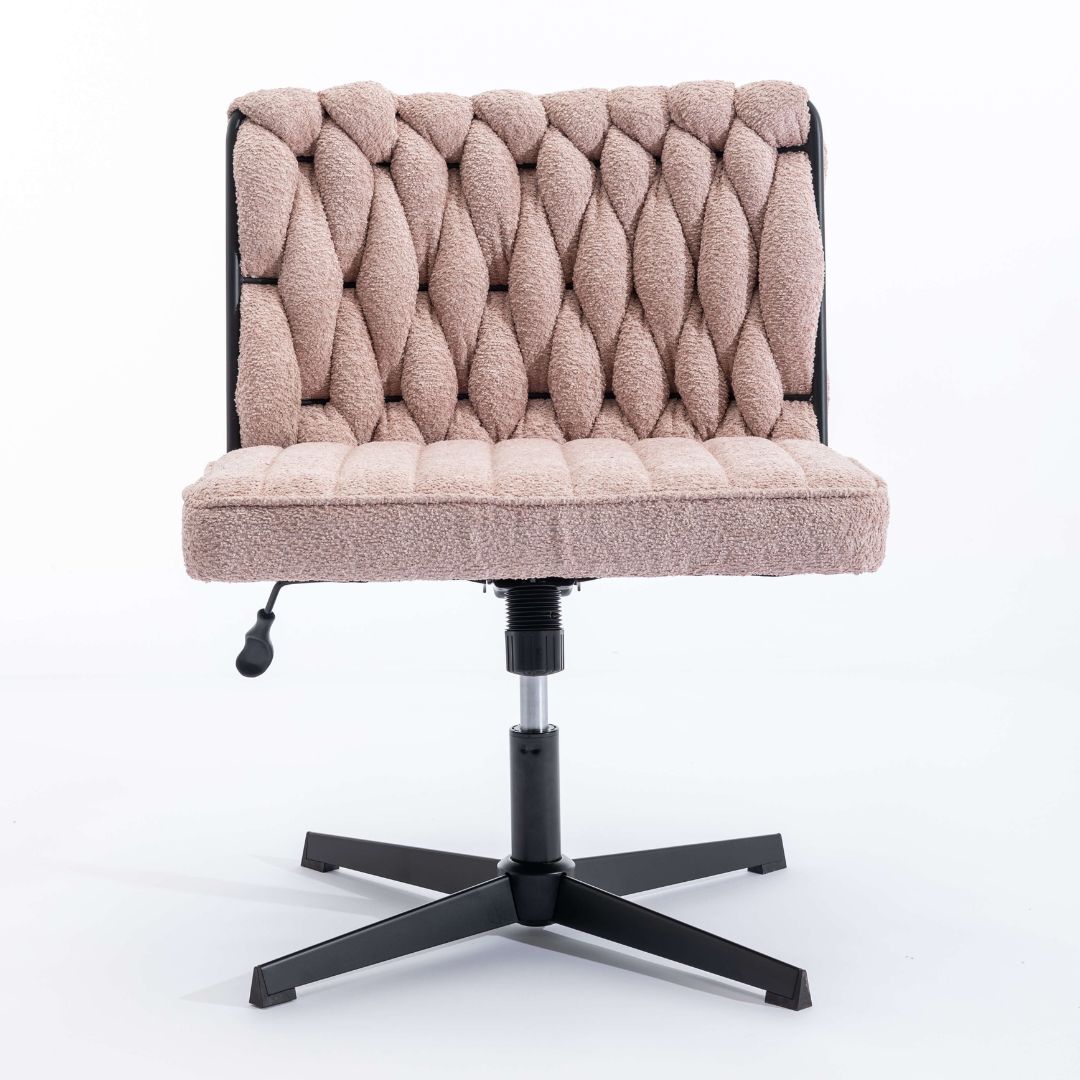 Elegant armless office chair in a bright workspace, showcasing its modern design and velvet texture.