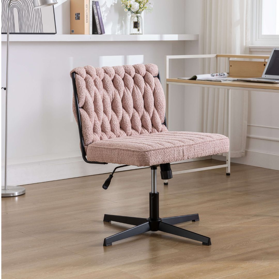 Elegant armless office chair in a bright workspace, showcasing its modern design and velvet texture.