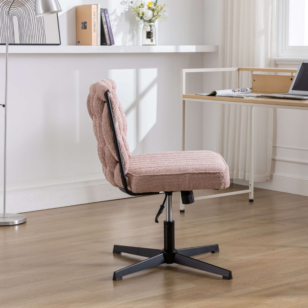 Elegant armless office chair in a bright workspace, showcasing its modern design and velvet texture.