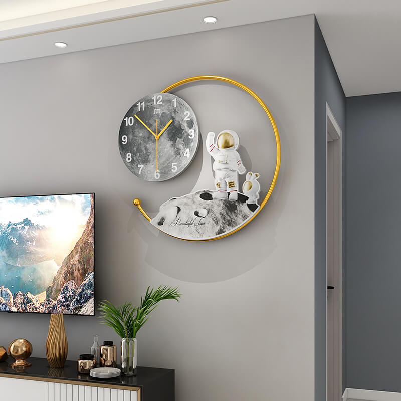 A side angle of the wall clock highlighting its geometric shape and sleek finish against a minimalist background.