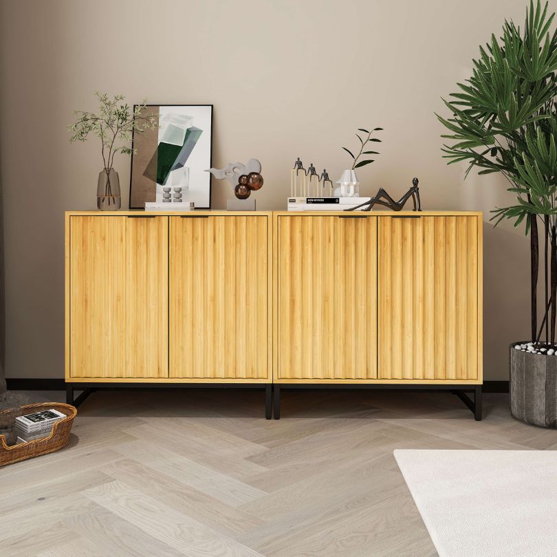 Elegant bamboo storage cabinet set with doors in a bright living room, showcasing its modern design and functionality.