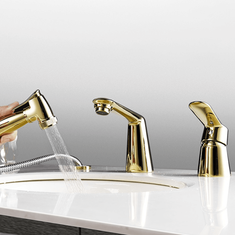 Close-up of the modern sink faucet sprinkler feature in use with water flow