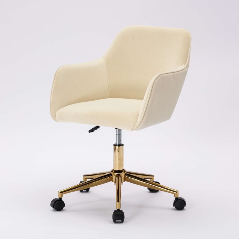 Elegant beige velvet swivel chair showcasing its plush upholstery and swivel feature.