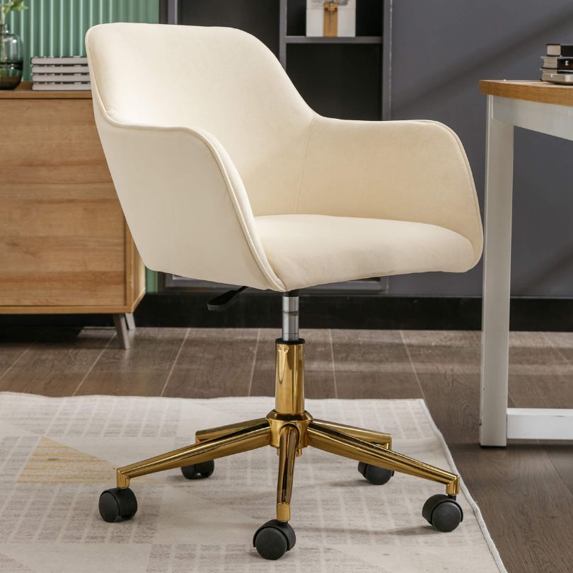 Elegant beige velvet swivel chair showcasing its plush upholstery and swivel feature.
