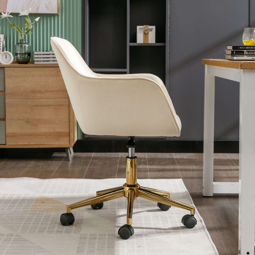 Close-up view of the adjustable gold metal base of the modern desk chair.