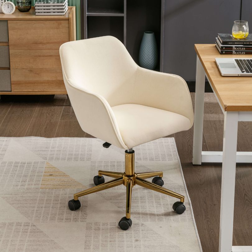 Elegant beige velvet swivel chair showcasing its plush upholstery and swivel feature.