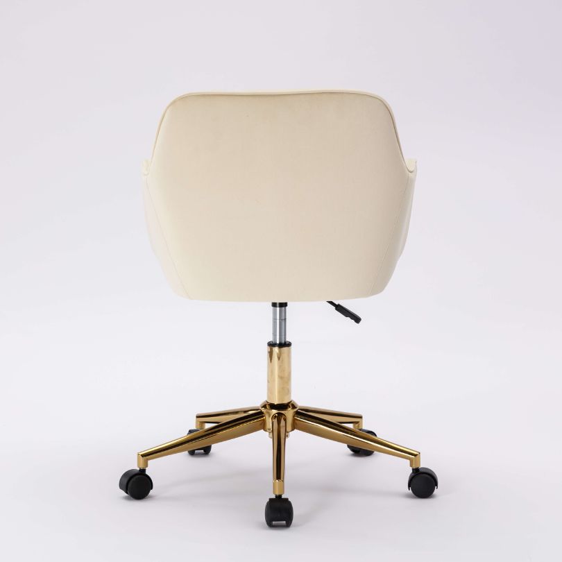Close-up view of the adjustable gold metal base of the modern desk chair.