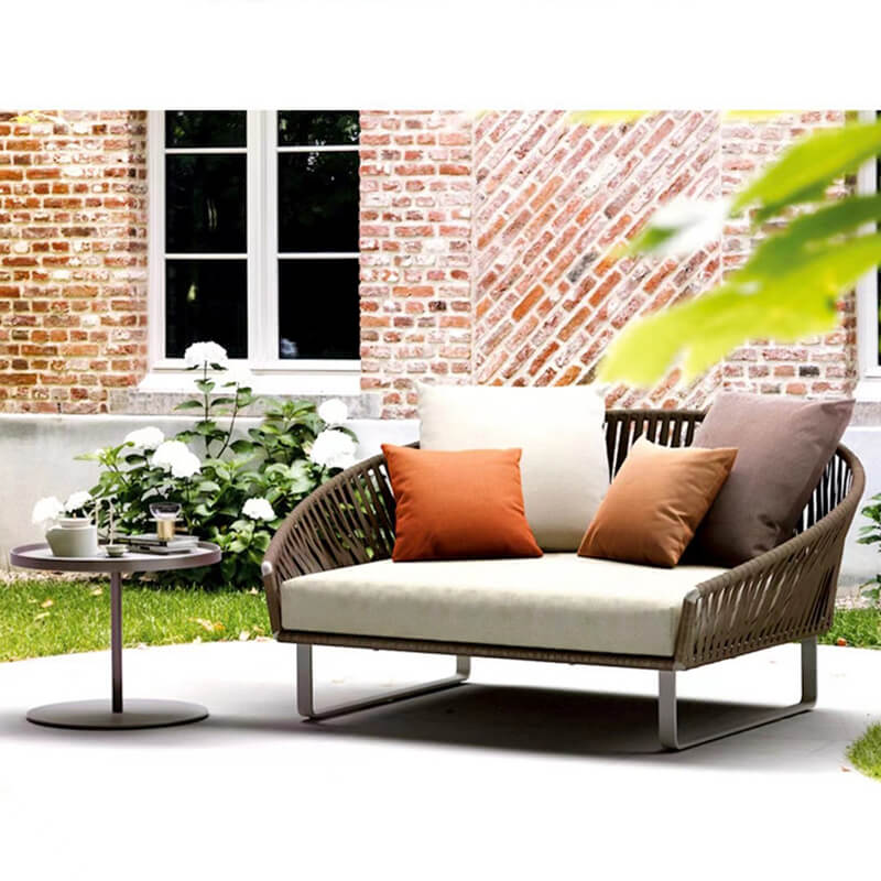 Close-up of the coffee table and footstool from the Elegant Rattan Modular Outdoor Sofa Set, highlighting the craftsmanship.