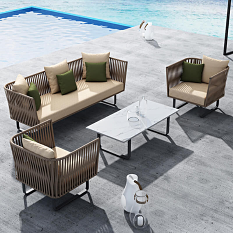 Elegant Rattan Modular Outdoor Sofa Set positioned in a garden setting, showcasing its stylish design.