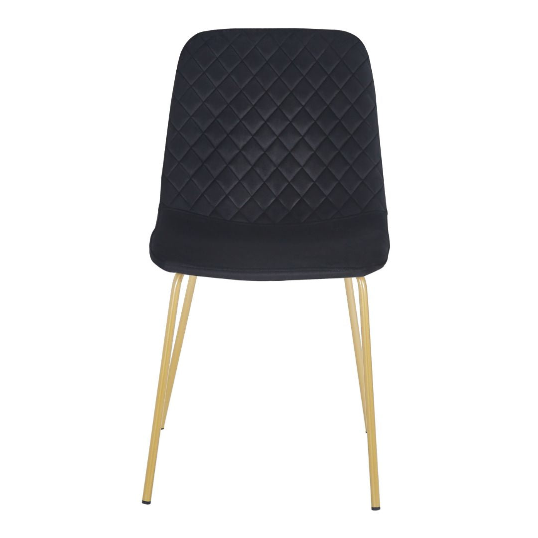 Set of four luxury dining chairs arranged around a dining table, perfect for stylish gatherings.