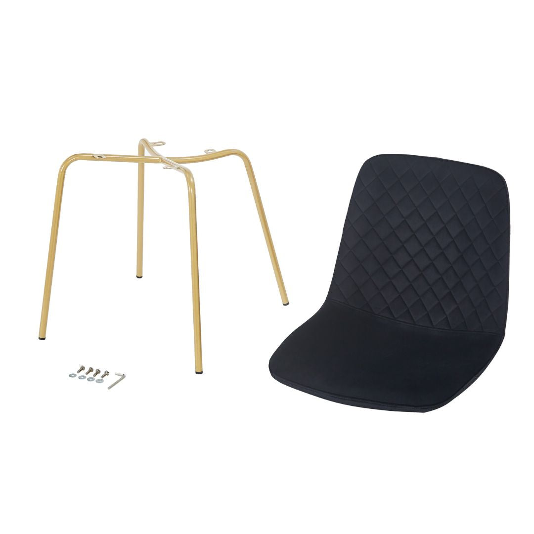 Elegant view of black velvet dining chair with gold legs, showcasing its modern design.