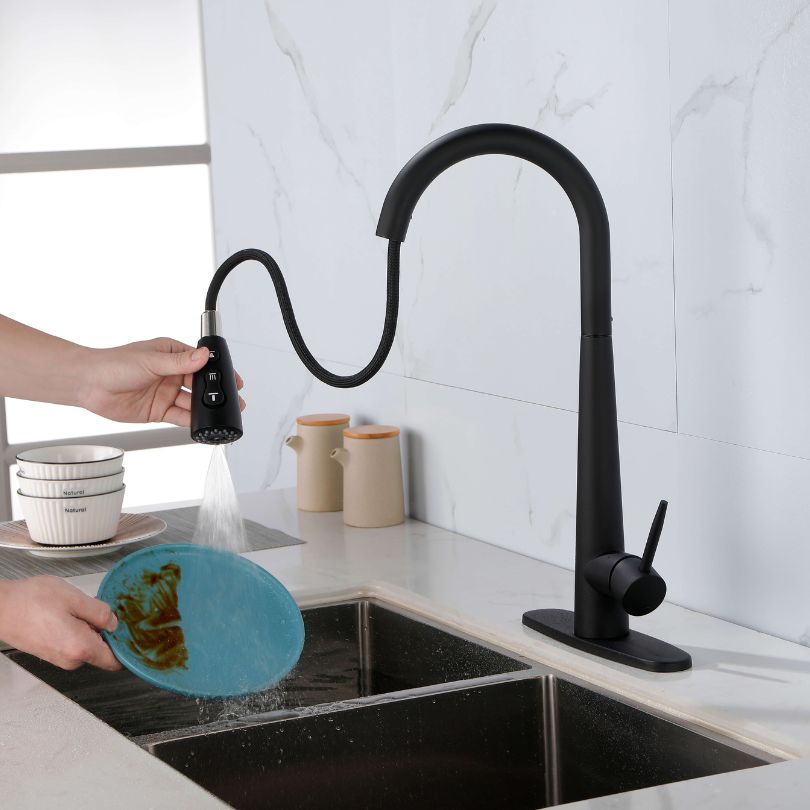 Sleek black kitchen faucet featuring a pull-out sprayer in a modern kitchen setting.