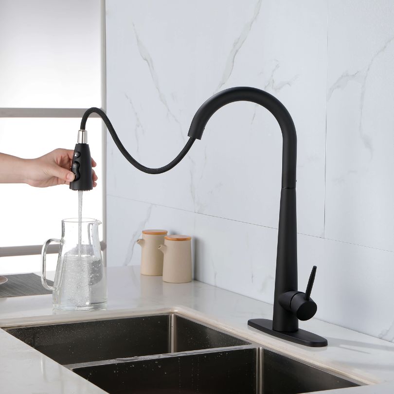 Close-up of the elegant single handle on the black kitchen faucet with pull-out sprayer.