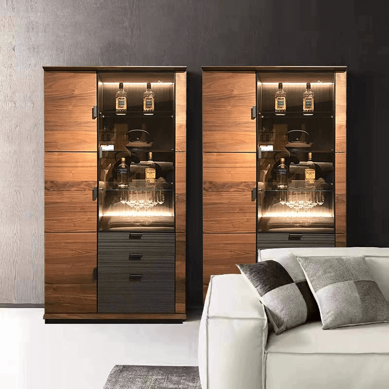 Elegant black walnut wine cabinet showcasing wine bottles and glasses from a side angle.